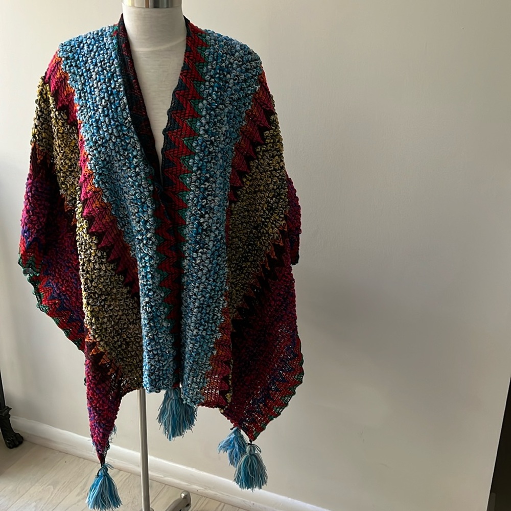 Wrap around knitted shawl with tassels